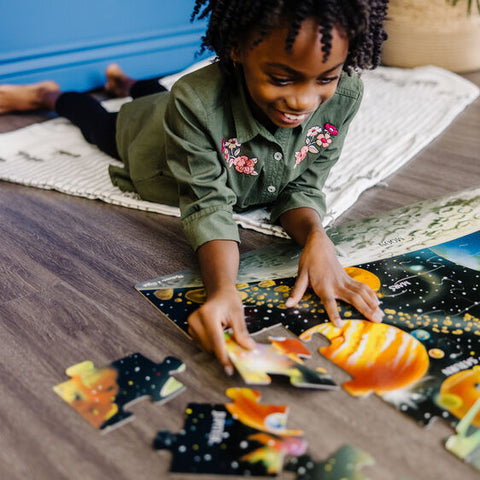 Child putting puzzle together.