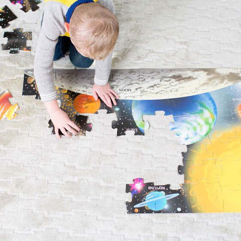Child putting puzzle together.