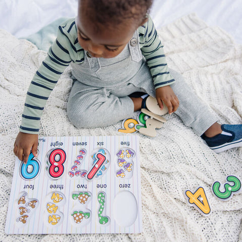 Child putting puzzle together