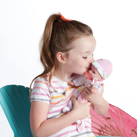 Girl Kissing Baby Doll's Face