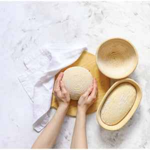 Person Removing Bread Dough from Bowl