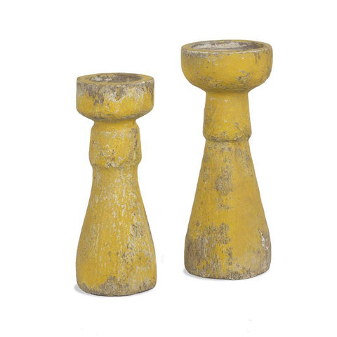 Weathered yellow candle holders