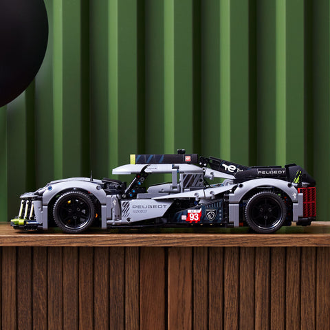 LEGO Technic PEUGEOT 9X8 24H Le Mans Hybrid Hypercar on shelf