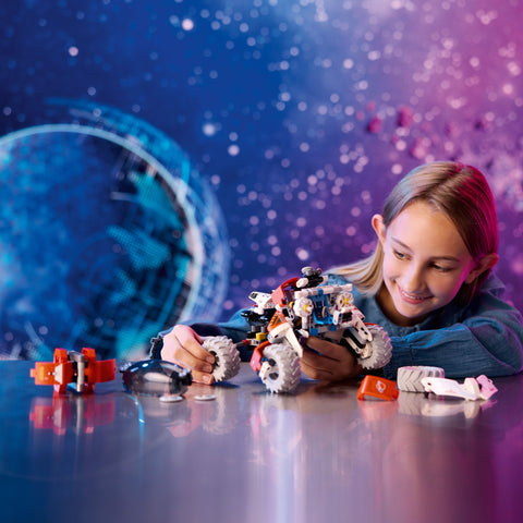 Girl assembling LEGO Technic Surface Space Loader LT78