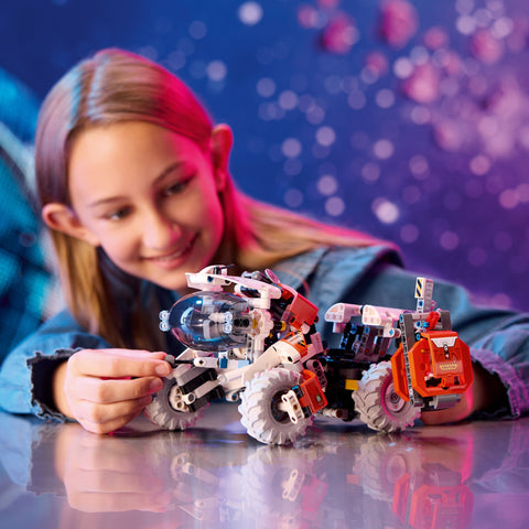 Girl playing with LEGO Technic Surface Space Loader LT78