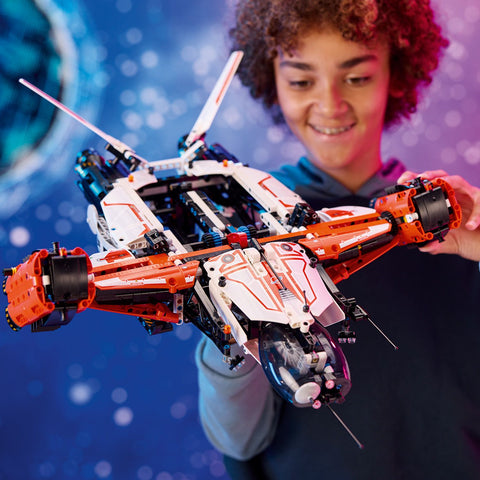 Boy playing with LEGO VTOL Heavy Cargo Spaceship LT81