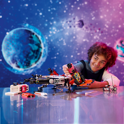 Boy assembling LEGO VTOL Heavy Cargo Spaceship LT81