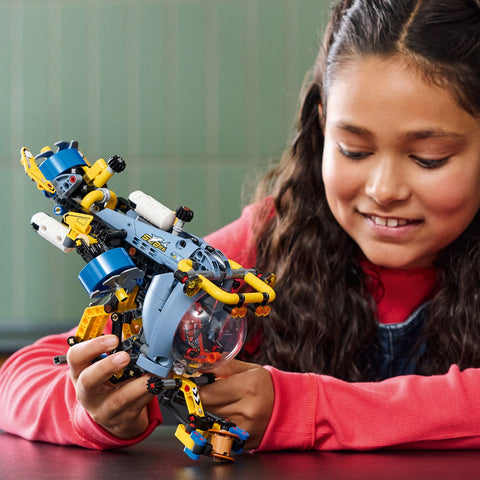 Girl playing with the LEGO Technic Deep-Sea Research Submarine 42201