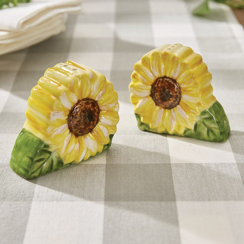 Follow the Sun Salt & Pepper Set 4964-678 displayed on gray gingham table cloth