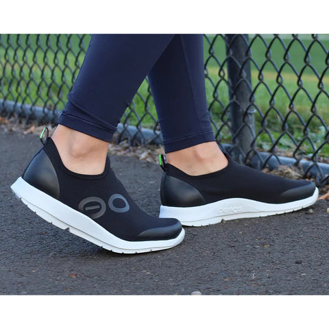 Woman Wearing Black & White Shoes