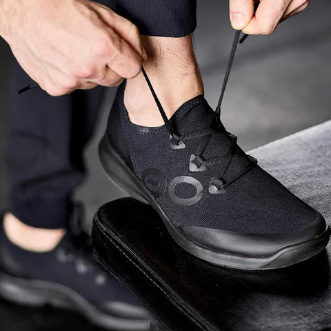 Man Lacing Up Shoe