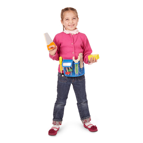 girl holding saw and wood block