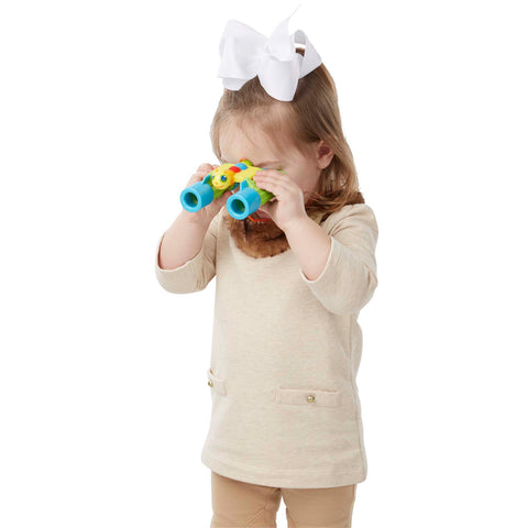 girl using Giddy Buggy binoculars