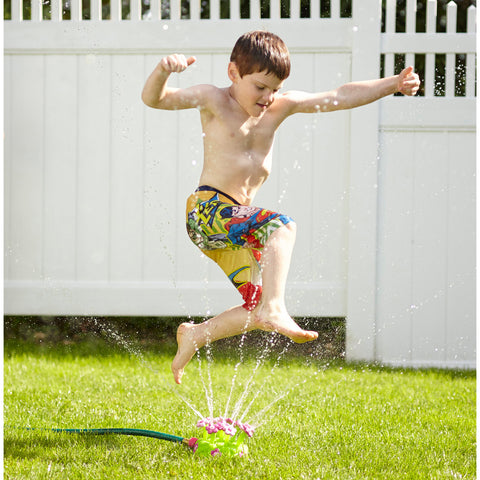 child enjoying Pretty Petals sprinkler