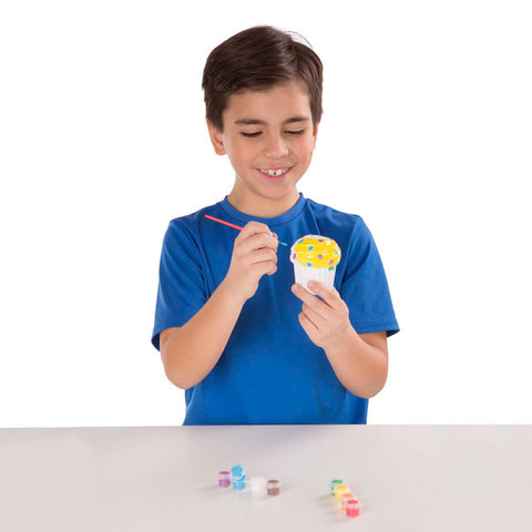 boy decorating cupcake bank