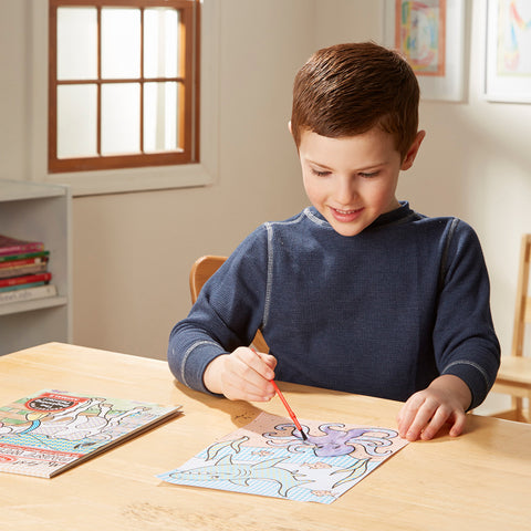 boy using paint with water