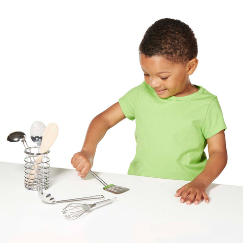 child with let's play house stir & serve cooking utensils