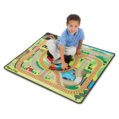 boy on train rug with train