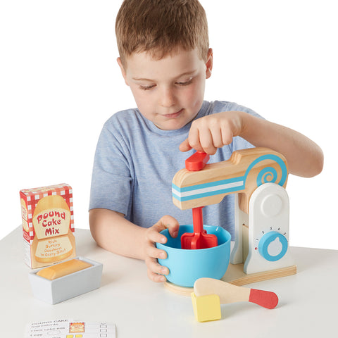 boy with wooden mixer