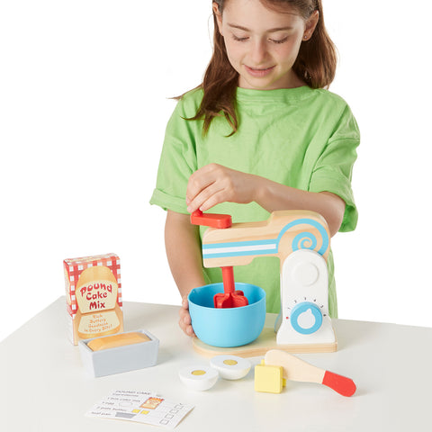 girl mixing pretend cake