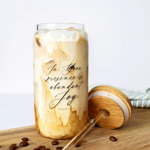 Grace & Joy Company Abundant Joy 18 oz. Glass Cold Brew Tumbler filled with iced coffee