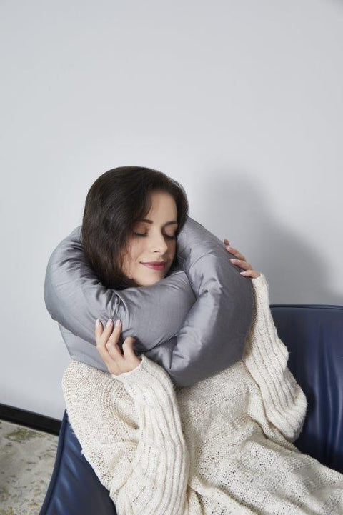 Woman using a Regal Comfort Bamboo Luxury Infinity Pillow