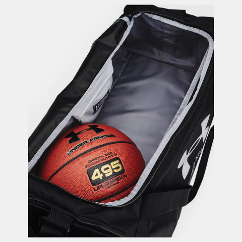 Black Under Armour medium size Undeniable 5.0 Duffle Bag with basketball inside