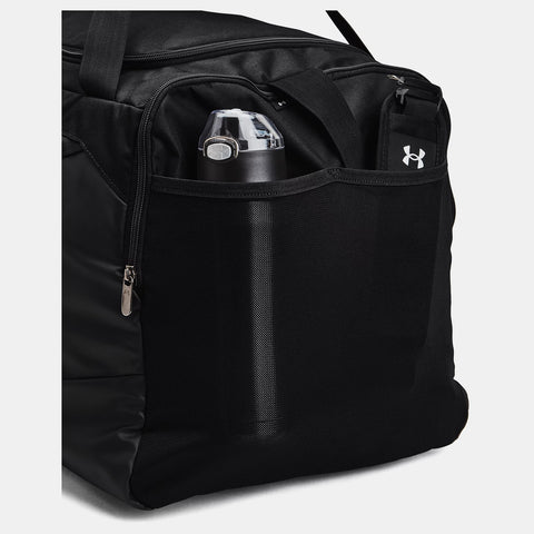 Bottle in mesh pocket on Black Under Armour Undeniable 5.0 Duffle Bag