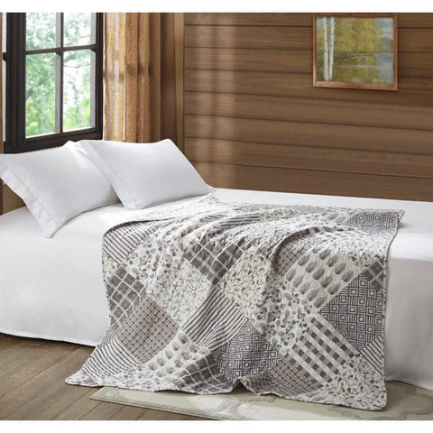 Bed with throw blanket