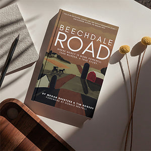 Hardcover Version of Beechdale Road Laying on a Table