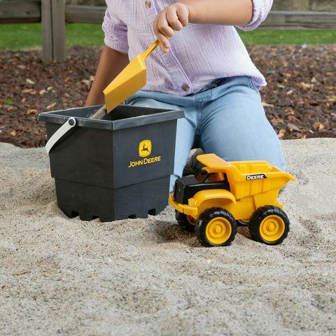 John Deere 3 Piece Construction Sand Box Set 47616 child dumping sand in bucket with shovel