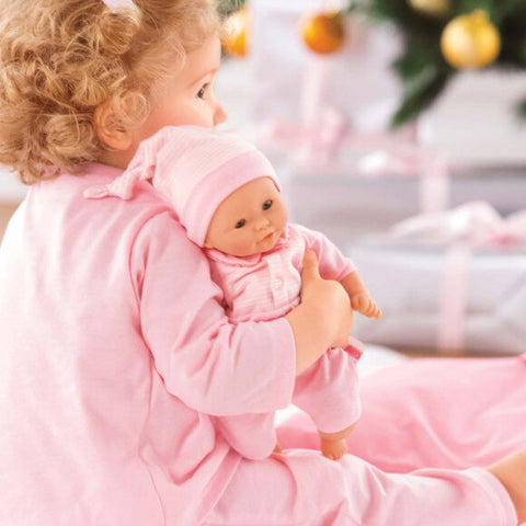 Girl holding doll