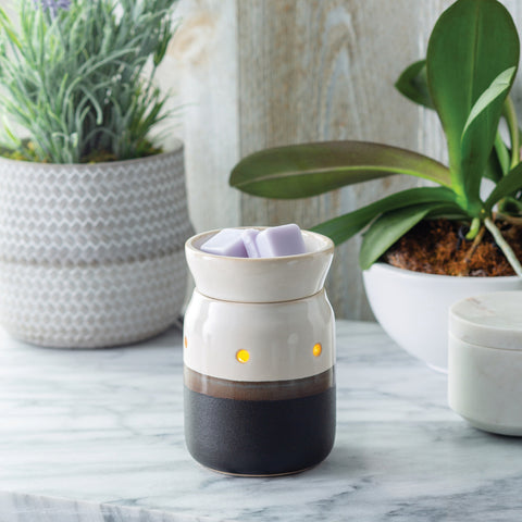 Ivory and iron wax warmer