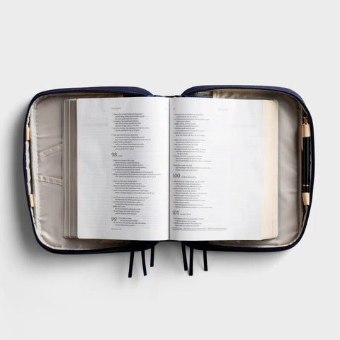 Gold Cross- Navy Canvas Bible Cover J7418 open case with a bible in it