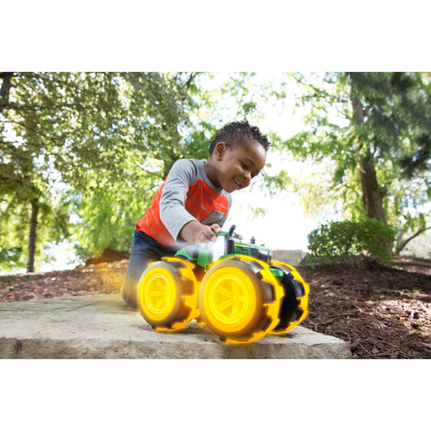 Boy playing with tractor