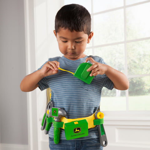 Child playing with tool set