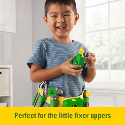 Boy playing with toy tool set