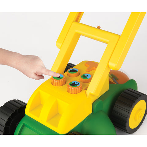 Pressing lawn mower buttons