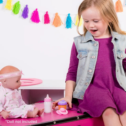 Child playing with doll and sippy cup set