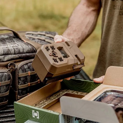 Man Taking Camera Out of Box