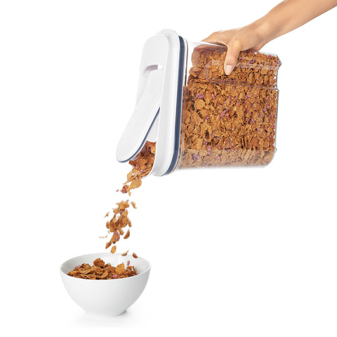 Pouring out cereal.