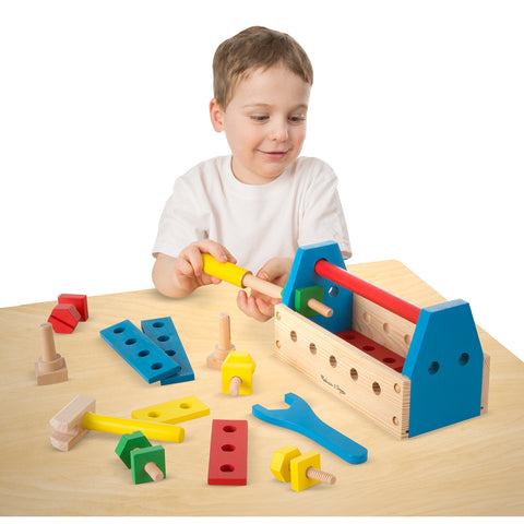 Boy playing with tool kit