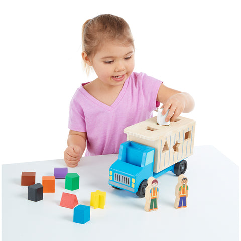 Girl playing with truck