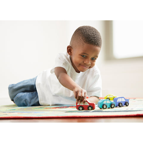 Boy playing on road rug