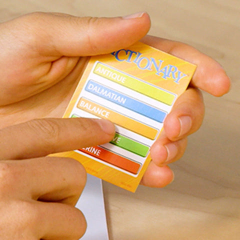 Hand holding pictionary card