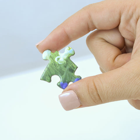 Hand holding puzzle piece