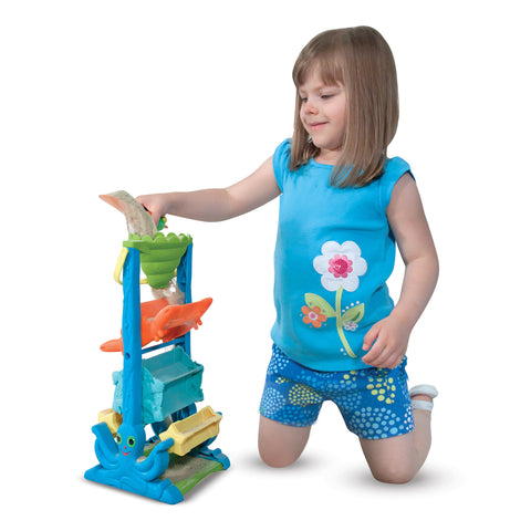 Girl playing with sand toy