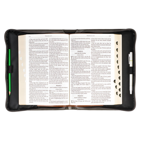 open Bible cover with Bible and pens inside