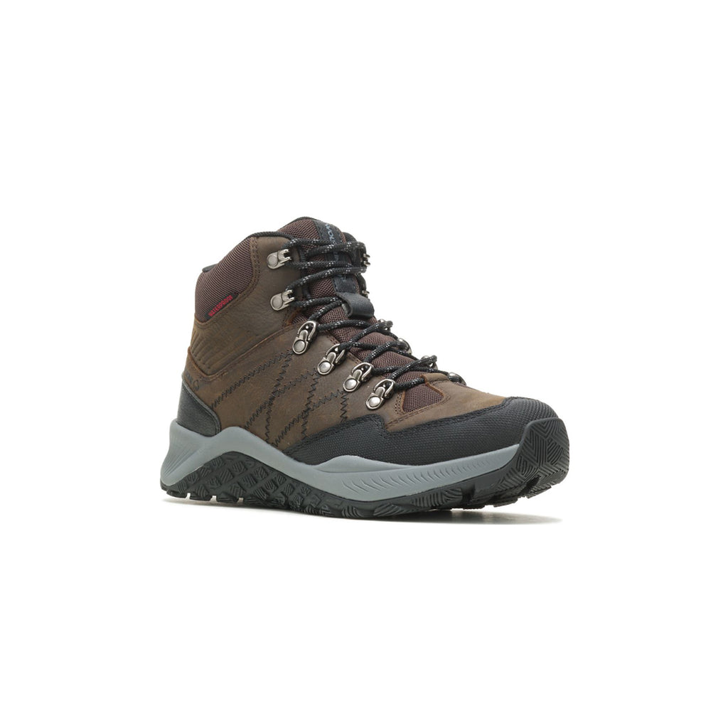 Men's Brown and Gray Merrell Hiking Shoes Holding Stick · Free Stock Photo