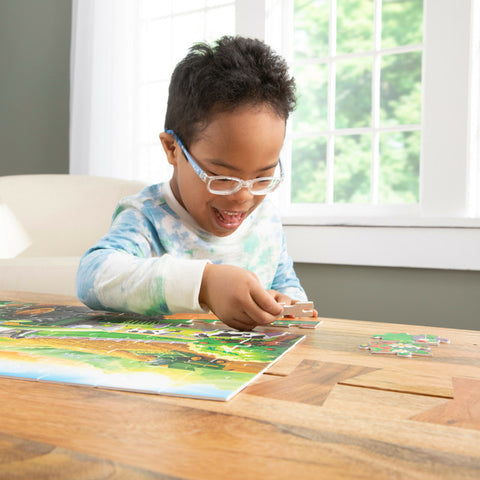 child putting puzzle together